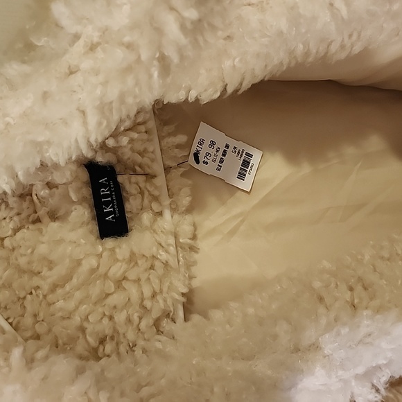 Faux fur coat. Silk lined. Snap closure down front of coat. High neck. Pockets. - Picture 2 of 5